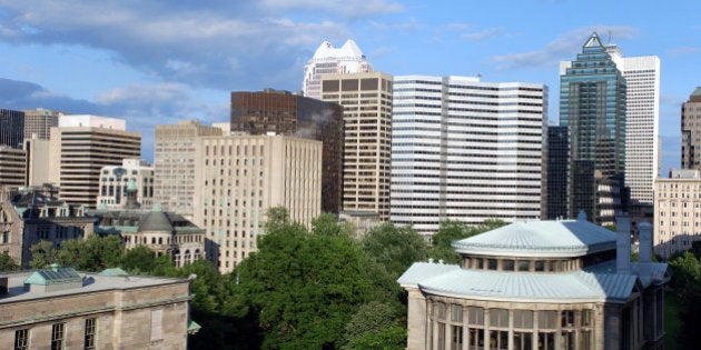 'McGill University's leafy campus is in the foreground, and downtown office buildings in the background.'