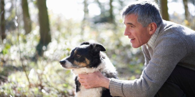 Man with dog in countryside