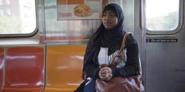 QUEENS, NY - MAY 11: High school senior Sharmin Hossain rides the subway May 11, 2010 on her way to school in Queens, NY. She will spend 90 minutes traveling each way to school by subway and bus. Sharmin will graduate from Bayside High School and enter Albany University as a freshman in September, 2010. She is a second generation Bangladeshi-American, speaks fluent Bengali and is active within social justice and community organizations. (Photo by Robert Nickelsberg/Getty Images)