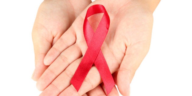 aids ribbon in hands isolated...