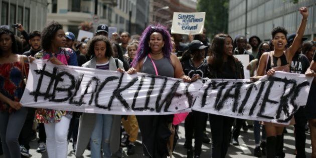 Demonstrators from the Black Lives Matter movement march through the streets of central London on July 10, 2016, during a demonstration against the killing of black men by police in the US. Police arrested scores of people in demonstrations overnight Saturday to Sunday in several US cities, as racial tensions simmer over the killing of black men by police. / AFP / DANIEL LEAL-OLIVAS (Photo credit should read DANIEL LEAL-OLIVAS/AFP/Getty Images)