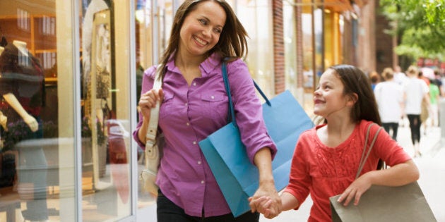 Caucasian mother and daughter shopping together