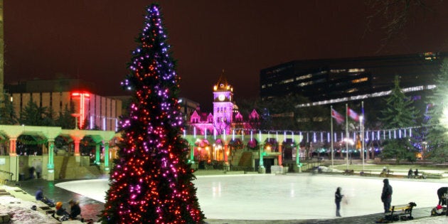 Downtown Calgary's Olympic Plaza glowing on a cold winter night.