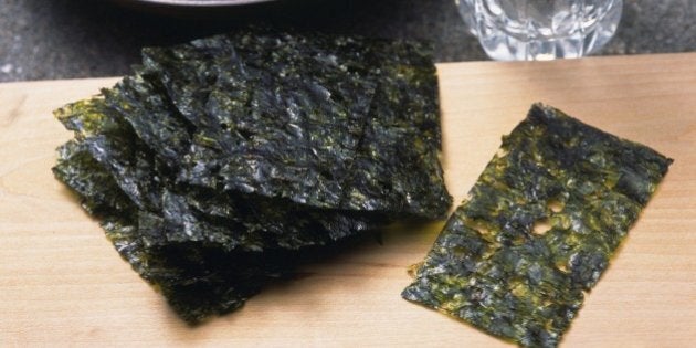 Image of Some Dried Seaweed on a Wooden Surface and Some Sake, High Angle View