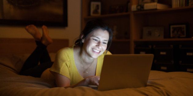Woman With laptop at night