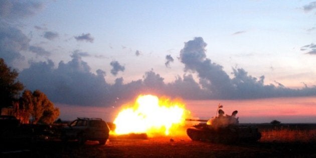 ALEPPO, SYRIA - NOVEMBER 01: Flames rise after the Syrian opponents attacked Daesh terrorist organization's positions with the howitzers in the Herbel village of the Mari district in Aleppo, Syria on November 1, 2015. (Photo by Huseyin Nasir /Anadolu Agency/Getty Images)