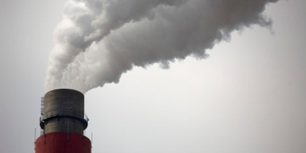 In this Nov. 3, 2015 photo, smoke and steam rise from the smokestack of a coal-fired power plant near Ordos in northern China's Inner Mongolia Autonomous Region. Chinaâs polluted air is still largely hazardous to health, and officials wonât even guess when air will finally reach levels that could be considered healthy. But some experts, officials and observers see this year's improvement as the start of a long-term upward trend in air quality resulting from central and local government measures to lower pollution. (AP Photo/Mark Schiefelbein)