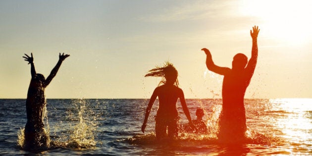 silhouettes of young group of...