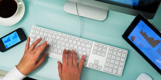 Overhead of workplace with multiple digital devices