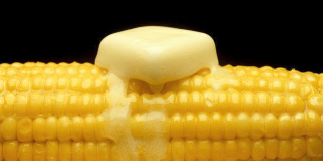 Butter melting on ear of corn, close-up