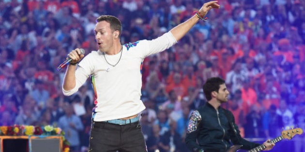 SANTA CLARA, CA - FEBRUARY 07: Chris Martin of Coldplay performs onstage during the Pepsi Super Bowl 50 Halftime Show at Levi's Stadium on February 7, 2016 in Santa Clara, California. (Photo by Jeff Kravitz/FilmMagic)