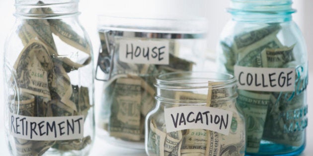 Close up of savings jars with money