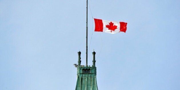 OTTOWA, CANADA - JUNE 30: Canadian national flag flies at half mast over the Peace Tower in Ottowa, Canada on June 30, 2016 following the recent terrorist attack at Istanbul Ataturk International Airport. (Photo by Seyit Aydogan/Anadolu Agency/Getty Images)