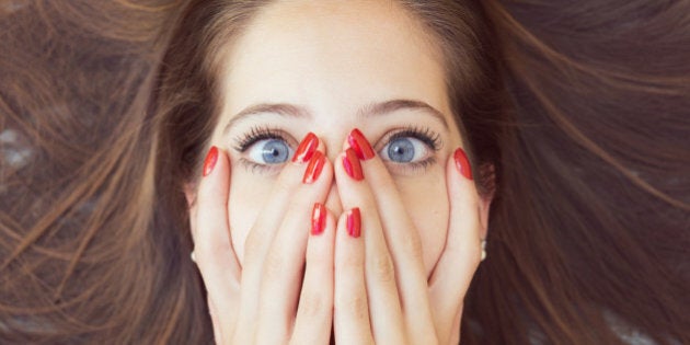 Shamed cute girl with red nails