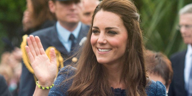 Britain's Kate, the Duchess of Cambridge, waves following a walk in Civic Square in Wellington, New Zealand, Wednesday, April 16, 2014. Prince William and Kate are on the last day of their official visit to New Zealand before traveling to Australia with their son, Prince George. (AP Photo/Marty Melville, Pool)