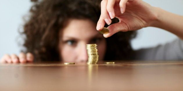 young woman with pile of coins