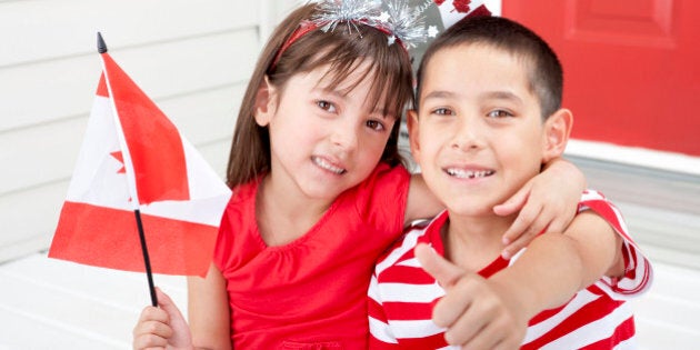 Siblings age 6 and 7 celebrating Canada Day