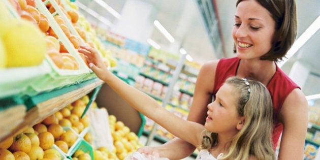 Mother and daughter grocery shopping