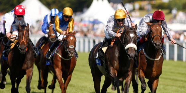 CHICHESTER, ENGLAND - JULY 31: Gregory Benoit riding Amy Eria (2R) win The L'Ormarins Queen's Plate Stakes at Goodwood racecourse on July 31, 2015 in Chichester, England. (Photo by Alan Crowhurst/Getty Images)