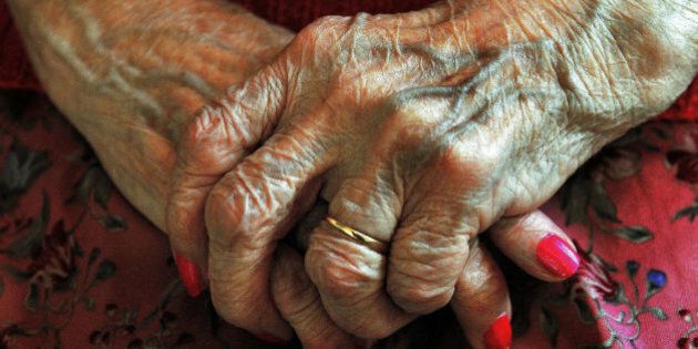File photo dated 05/12/08 of the hands of an elderly woman. Close friends and family of patients who are dying in hospitals in England are not always being told about decisions about their loved one's care, a new audit has found.