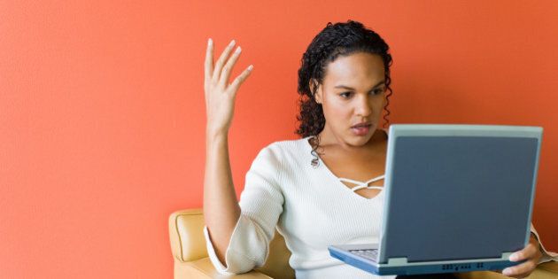 Frustrated businesswoman with laptop computer