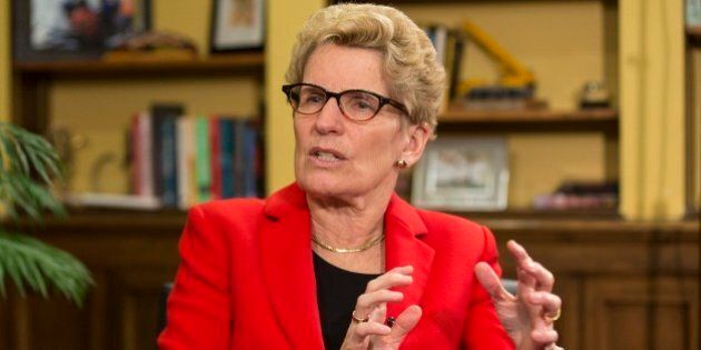 TORONTO, ON - APRIL 10: Ontario Kathleen Wynne sits in her office with Star Queen's Park reporter Martin Regg Cohn. (Bernard Weil/Toronto Star via Getty Images)