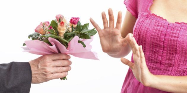 Angry wife refusing a flowers for apology
