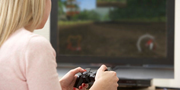 Young Woman Playing With Game Console