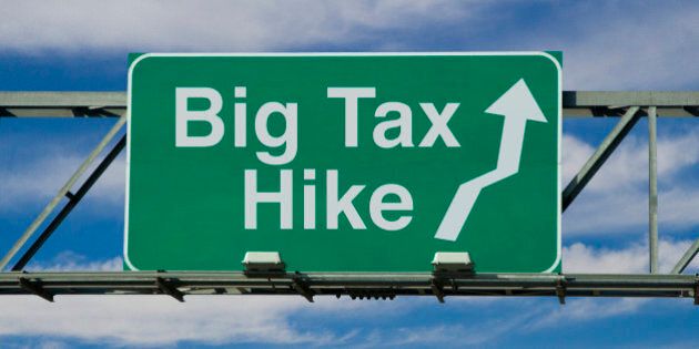 A road sign that says 'Big Tax Hike.'
