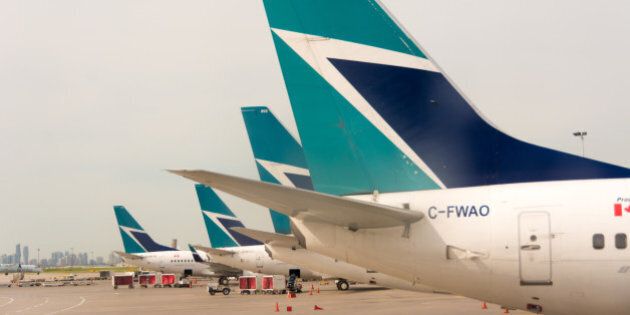 TORONTO, ONTARIO, CANADA - 2014/06/23: Westjet plane tails in Pearson International Airport. Westjet is an economical Canadian Airline serving mostly tourist destinations. (Photo by Roberto Machado Noa/LightRocket via Getty Images)