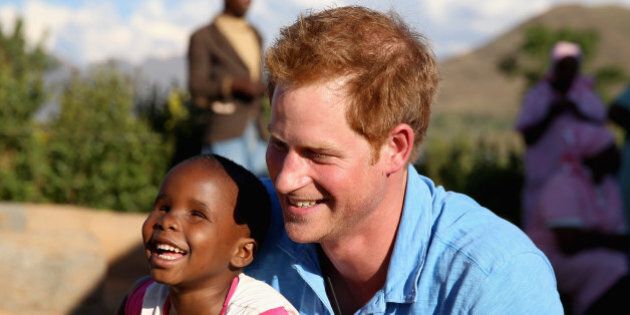 PITSENG, LESOTHO - DECEMBER 06: Prince Harry plays with a three year old blind girl called Karabo during a visit to Phelisanong Children's Home on December 6, 2014 in Pitseng, Lesotho. Prince Harry was visiting Lesotho to see the work of his charity Sentebale. Sentebale provides healthcare and education to vulnerable children in Lesotho, Southern Africa. The particular theme of his visit was to check on the progress of the Mamohato Childrens Centre which will provide vital support to children affected by HIV. Prince Harry founded Sentebale (which means Forget Me Not in Sesotho) with Prince Seeiso in 2006. (Photo by Chris Jackson/Getty Images for Sentebale)
