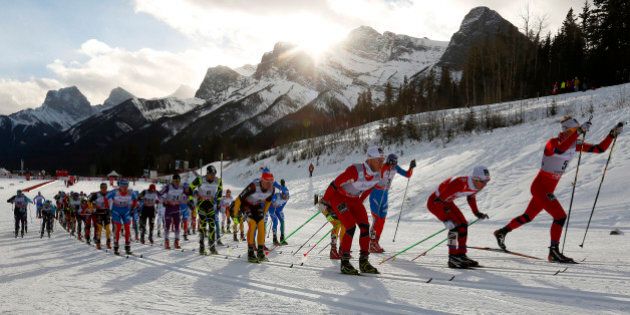 The mass start of the men's 30 km skiathlon race is seen during the Cross Country World Cup in Canmore, Alberta, December 16, 2012. REUTERS/Todd Korol (CANADA - Tags: SPORT SKIING)