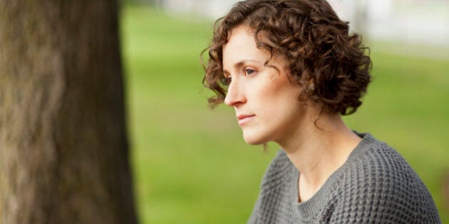 Mature woman thinking at the park