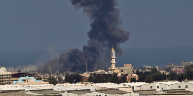 Smoke rises after an Israeli missile strike in Gaza strip, seen from the Israel Gaza Border, Wednesday, July 16, 2014. A Hamas website says Israel has fired missiles at the homes of four of its senior leaders as it resumed bombardment of Gaza, following a failed Egyptian cease-fire effort. Wednesday's bombings came after Hamas rejected an Egyptian truce proposal on Tuesday and instead launched more rockets at Israel. (AP Photo/Ariel Schalit)