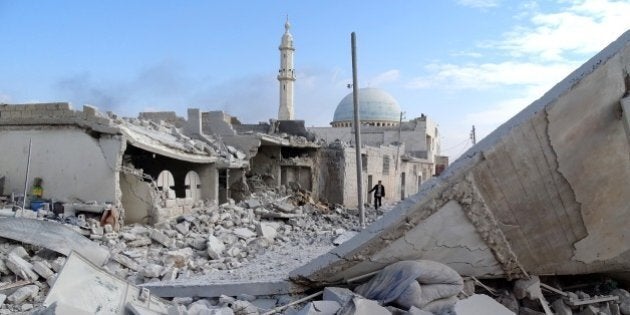 ALEPPO, SYRIA - FEBRUARY 2: Collapsed buildings are seen after Russian air crafts hit residential area at Anadan district of Aleppo, Syria on February 2, 2016. (Photo by Ahmed Muhammed Ali/Anadolu Agency/Getty Images)