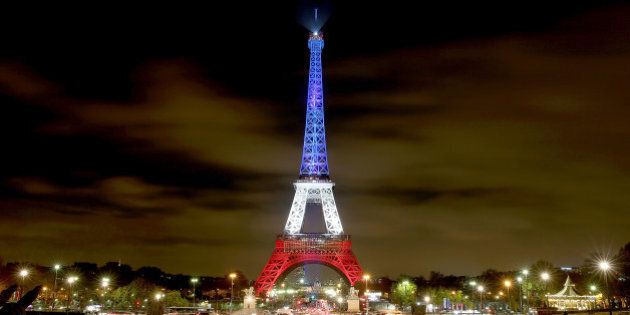PARIS, FRANCE - NOVEMBER 16: The Eiffel Tower is illuminated in Red, White and Blue in honour of the victims of Friday's terrorist attacks on November 16, 2015 in Paris, France. Countries across Europe joined France today to observe a one minute-silence in an expression of solidarity with the victims of the terrorist attacks, which left at least 129 people dead and hundreds more injured. on November 16, 2015 in Paris, France. (Photo by Pierre Suu/Getty Images)