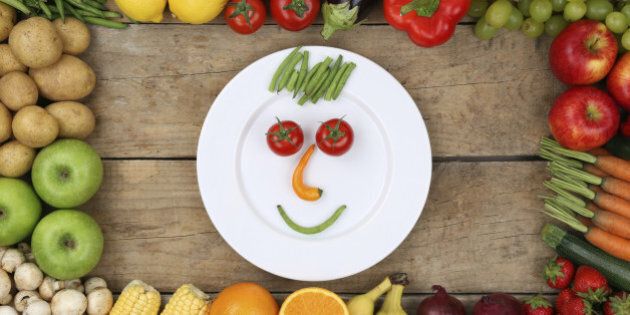 Healthy eating smiling face from vegetables and fruits on plate