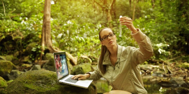 Pacific Islander researcher testing samples in jungle