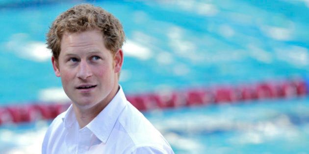 Britain's Prince Harry visits the Minas Tenis Club where England's Olympic team will practice during the 2016 Olympic and Paralympic Games in Belo Horizonte, Brazil, Tuesday, June 24, 2014. Prince Harry is in Brazil for the World Cup. (AP Photo/Bruno Magalhaes)