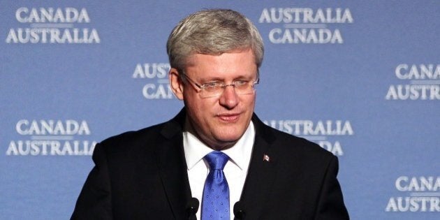 Canadian Prime Minister Stephen Harper speaks on stage at toast to Australian Prime Minister Tony Abbott during a dinner hosted by Prime Minister Harper in Ottawa, Canada on June 9, 2014. AFP PHOTO / Cole Burston (Photo credit should read Cole Burston/AFP/Getty Images)