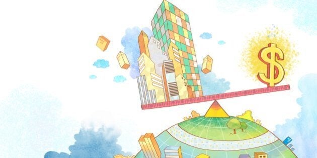 Illustration of dollar sign and buildings on seesaw