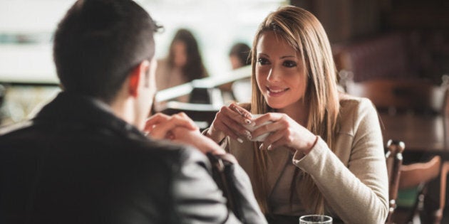 young couple at the bar having...