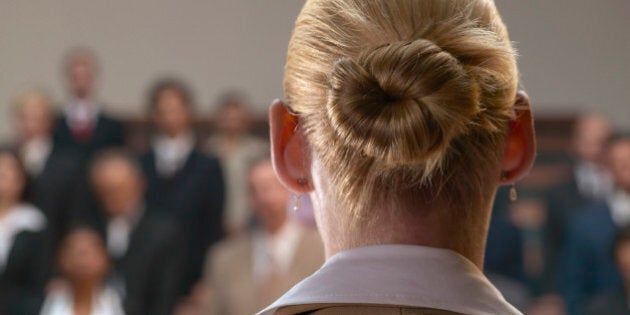 A woman giving a speech in front of an audience