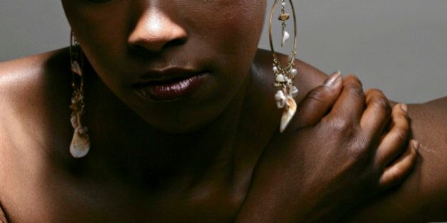 Portrait of young thoughtful African American woman, studio shot