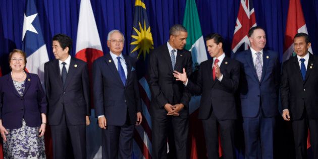 President Barack Obama talks with Mexicoâs President Enrique Pena Nieto as other leaders of the Trans-Pacific Partnership countries stand for a group photo in Manila, Philippines, Wednesday, Nov. 18, 2015, ahead of the start of the Asia-Pacific Economic Cooperation (APEC) summit. From left, Chileâs President Michelle Bachelet, Japanâs Prime Minister Shinzo Abe, Malaysiaâs Prime Minister Najib Razak, President Obama, Mexicoâs President Enrique Pena Nieto, New Zealandâs Prime Minister John Key, and Peruâs President Ollanta Humala Tasso. (AP Photo/Susan Walsh)