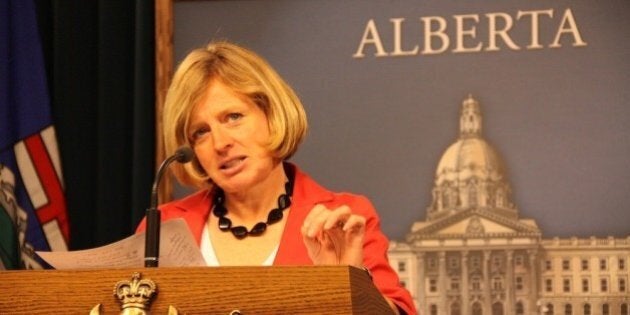 NDP MLA Rachel Notley at the podium in the Legislative Assembly of Alberta Media Room.