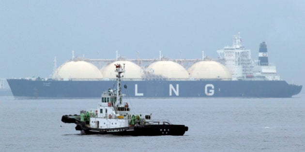 FILE - In this April 21, 2014 file photo, Liberian LNG, or Liquefied Natural Gas, tanker Al Hamra arrives at a port in Yokohama, southwest of Tokyo. Japan may find itself the odd man out when Prime Minister Shinzo Abe presents his governmentâs blueprint for combating climate change at a summit of the worldâs leading industrialized democracies Sunday and Monday, June 7-8, 2015. The Group of Seven host, German Chancellor Angela Merkel, has indicated she supports a pledge of eventual zero carbon emissions. Japan favors the use of coal, gas and nuclear power over green energy despite rapid growth of investment in renewables since all its nuclear reactors were taken offline following the 2011 disaster in Fukushima. (AP Photo/Koji Sasahara, File)