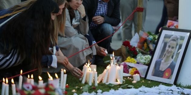 People light candles at the tributes in Parliament Square central London on June 17, 2016 in remembrance of Labour MP Jo Cox who was killed on a street in Birstall on June 16. Labour MP Jo Cox, a 41-year-old former aid worker also known for her advocacy for Syrian refugees, was killed on June 16, outside a library where she was supposed to meet constituents in Birstall in northern England, just a few miles (kilometres) from where she was born. / AFP / DANIEL LEAL-OLIVAS (Photo credit should read DANIEL LEAL-OLIVAS/AFP/Getty Images)