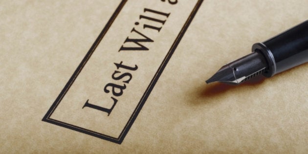 Close up of the bordered title of a last Will and Testament set on parchment paper with nib of fountain pen to the right.