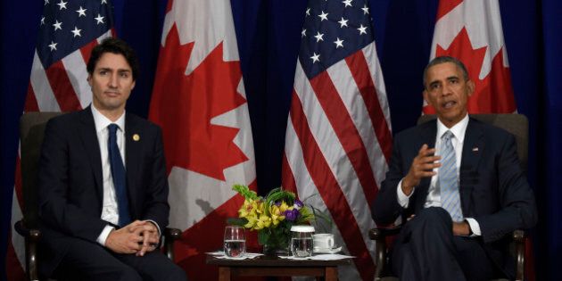 President Barack Obama, right, and Canadaâs Prime Minister Justin Trudeau, left, speak to reporters following their bilateral meeting at the Asia-Pacific Economic Cooperation summit in Manila, Philippines, Thursday, Nov. 19, 2015. (AP Photo/Susan Walsh)